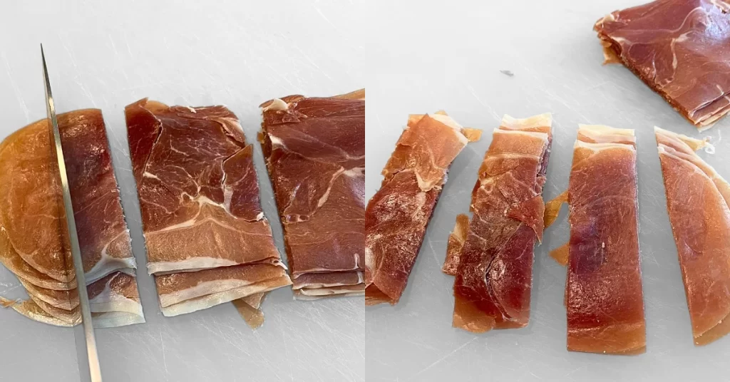 Chef knife cutting prosciutto