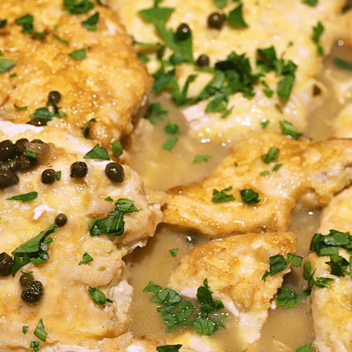 Chicken piccata with capers and lemon sauce and parsley flakes