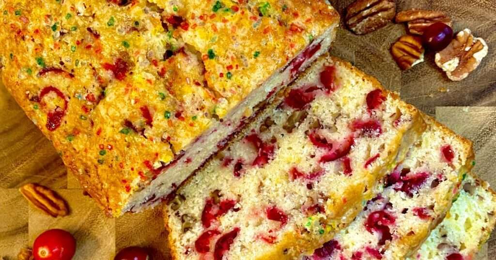 overhead photo of cranberry nut bread recipe with 3 slices cut