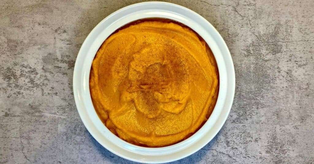 overhead shot of prepared roasted whipped butternut squash with cinnamon sprinkled on top